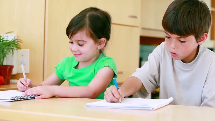 The children are doing their homework. Children doing tasks. Volunteering homework.